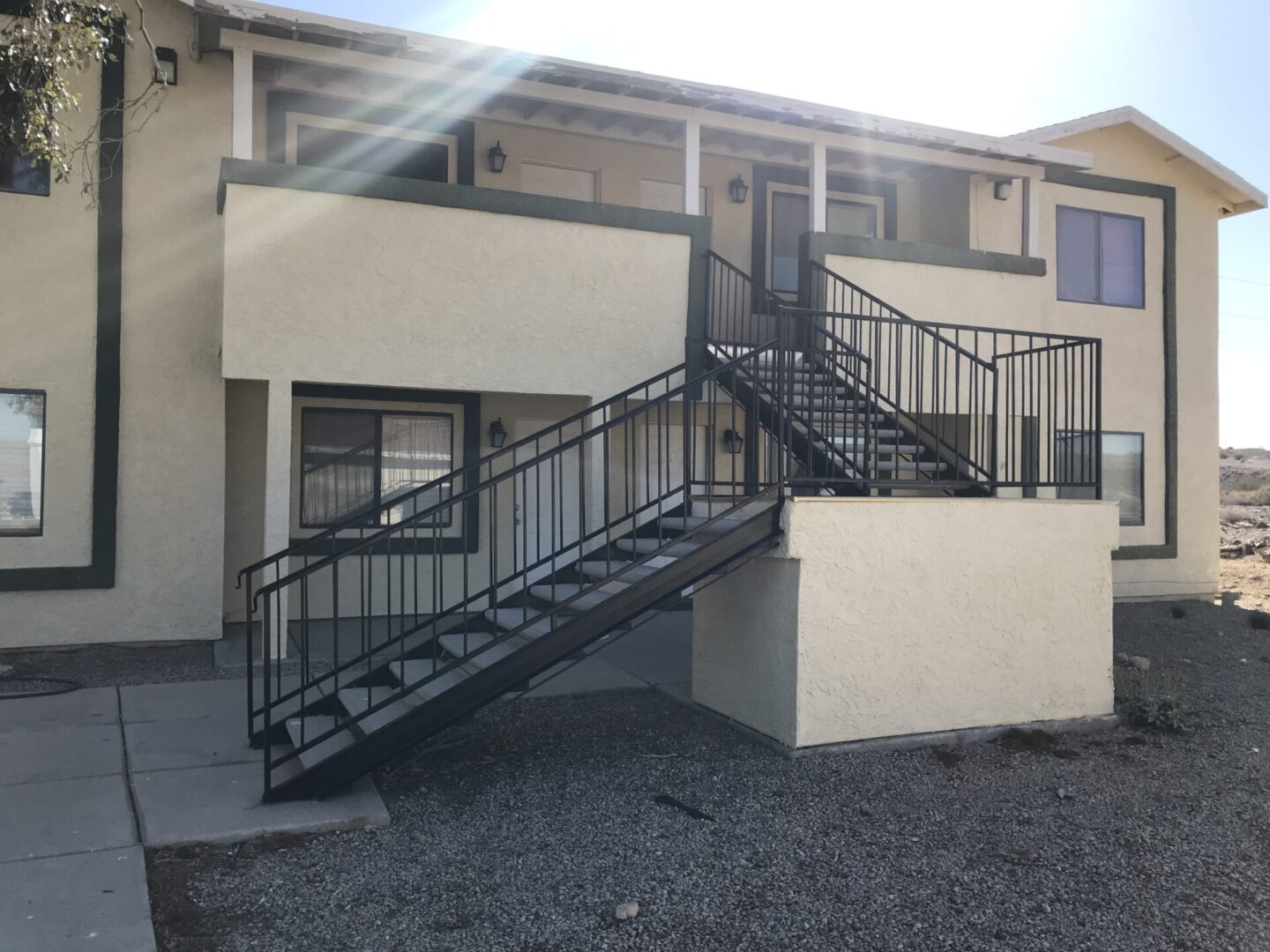 Apartment building exterior with stairs.