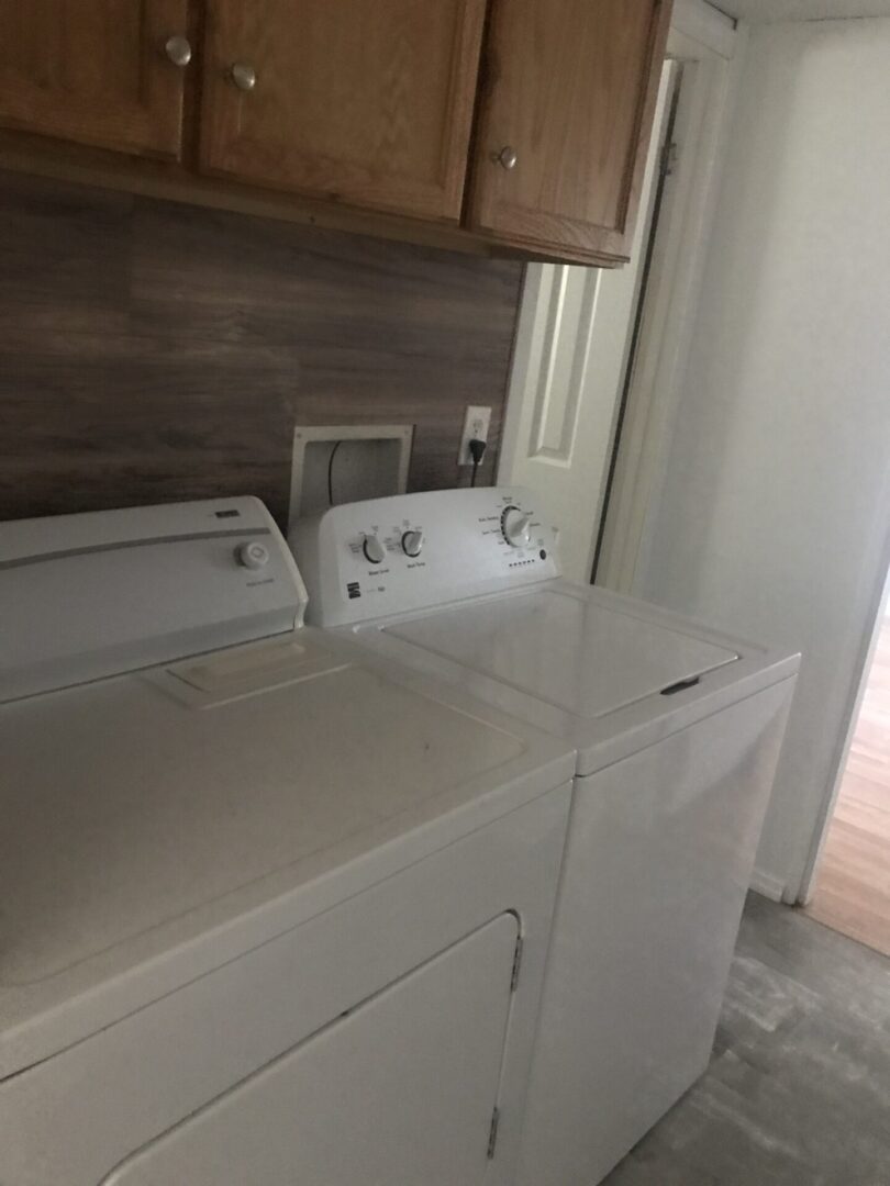White washer and dryer in laundry room.