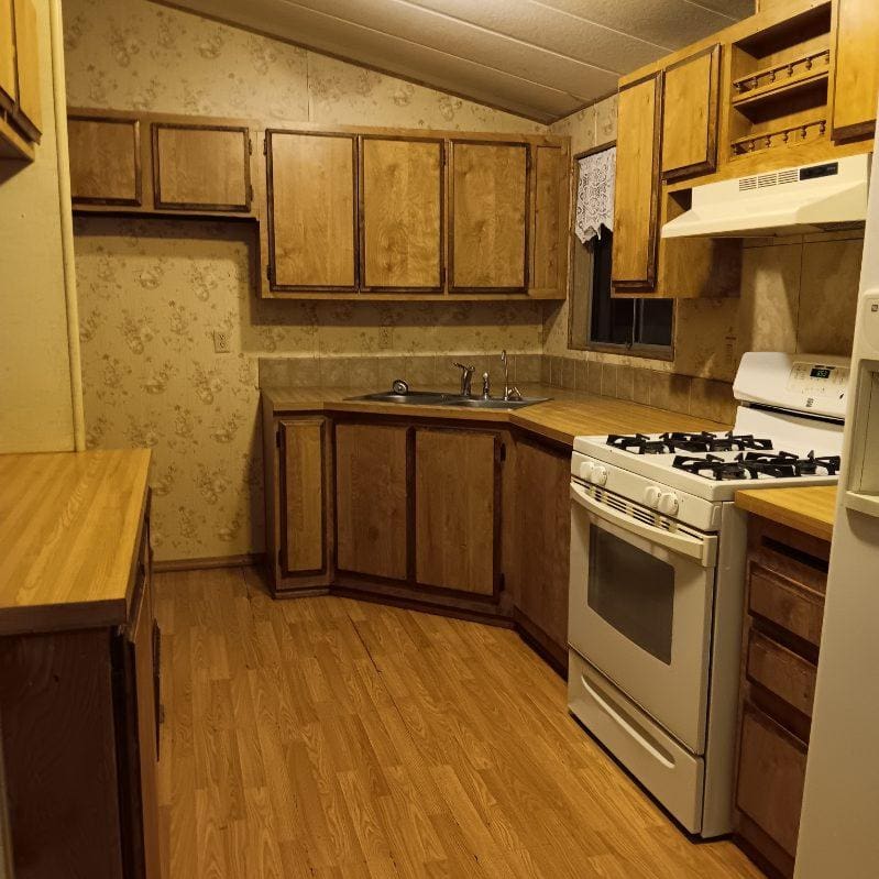 Small vintage kitchen with wooden cabinets