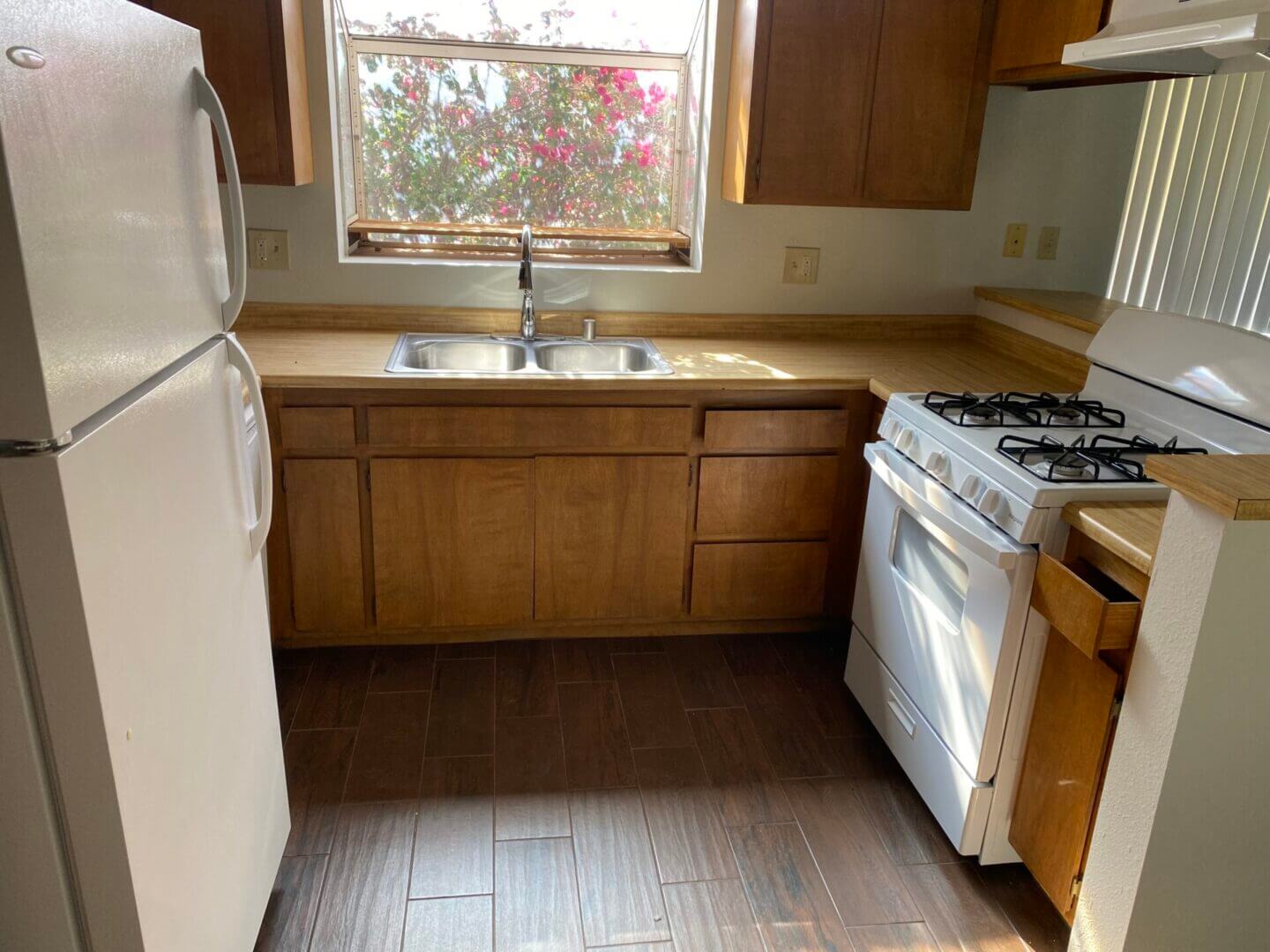 Compact kitchen with stove, refrigerator, sink