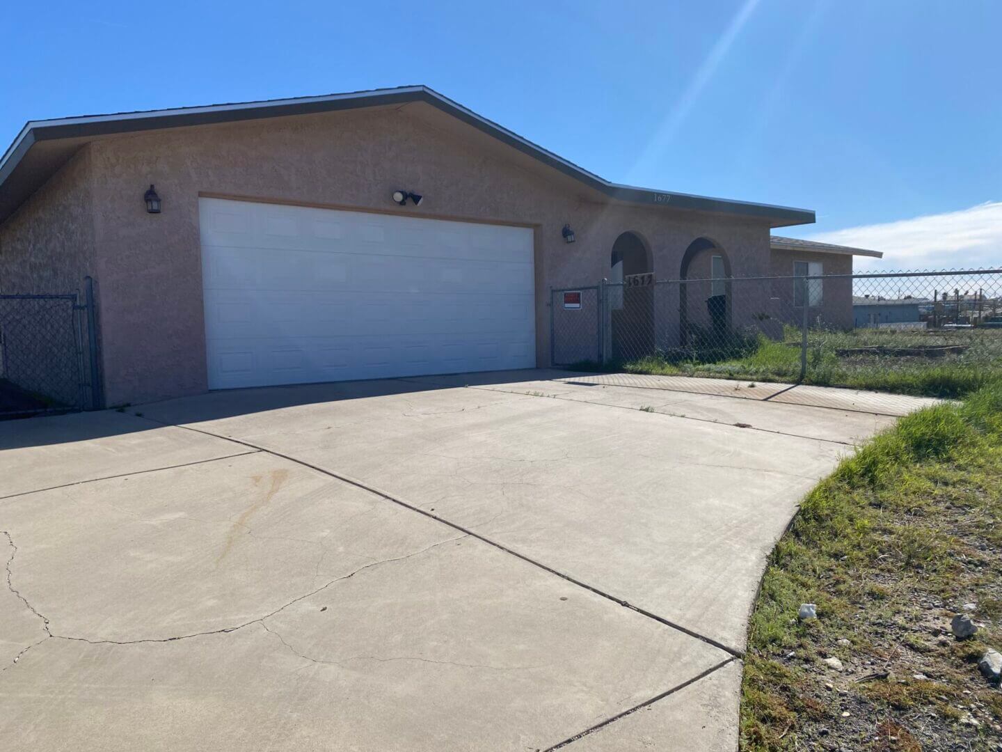 Single-story house with large garage and driveway